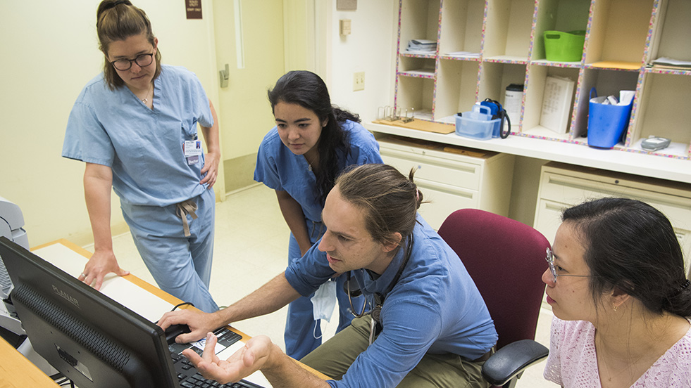 Resident physicians at work station