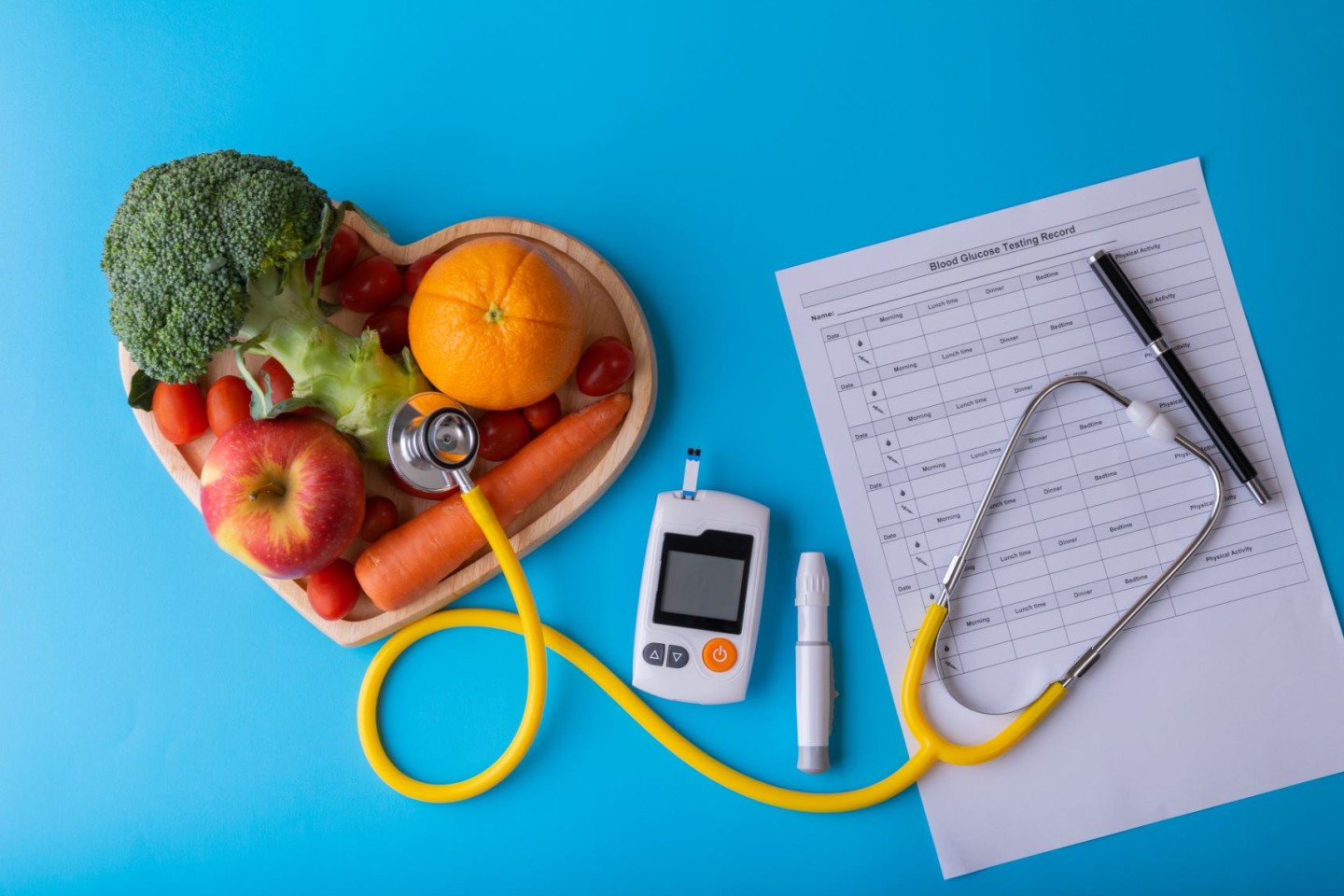 stethoscope, glucose monitor, fruits and vegetables