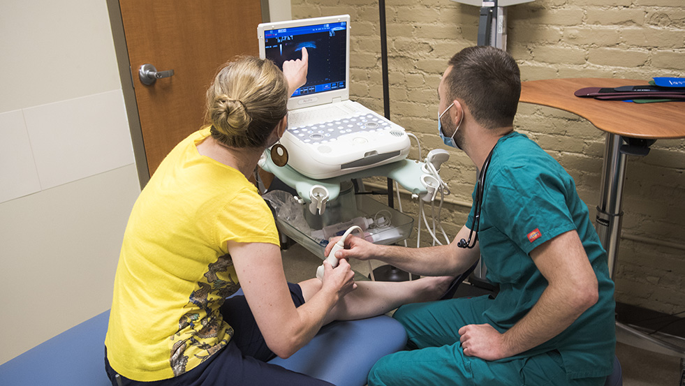 Doctors reviewing a knee ultrasound